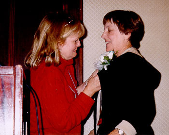 Tweety Yates pins a corsage.